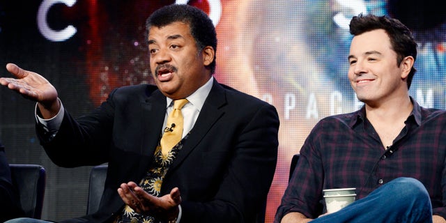 January 13, 2014. Host Neil DeGrasse Tyson (L) and Seth MacFarlane, executive producer of "Cosmos," participate in Fox Broadcasting Company's part of the Television Critics Association (TCA) Winter 2014 presentations in Pasadena, California.