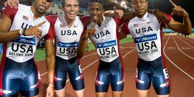 From left United State's Quentin Summers, Chris Carter, Justin Oliver and Bryshon Nellum pose for photographs after winning the final of the Men's 4x400 Meters Relay event of the IAAF Track and Field World Junior Championships held in Beijing, China, Sunday, Aug 20, 2006. The United States team clinch the gold medal with a time of 3:03.76 minutes. (AP Photo/Ng Han Guan)