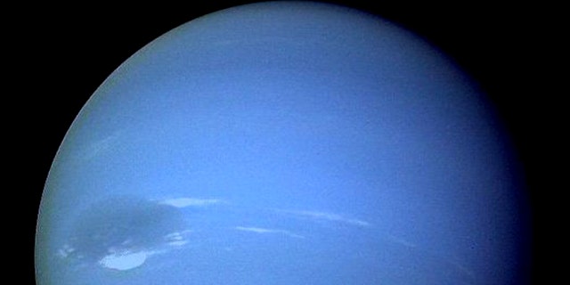 Neptune, showing off its "great dark spot."