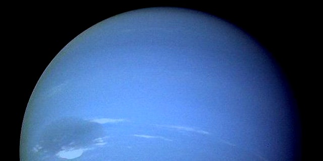 Neptune, showing off its "great dark spot."