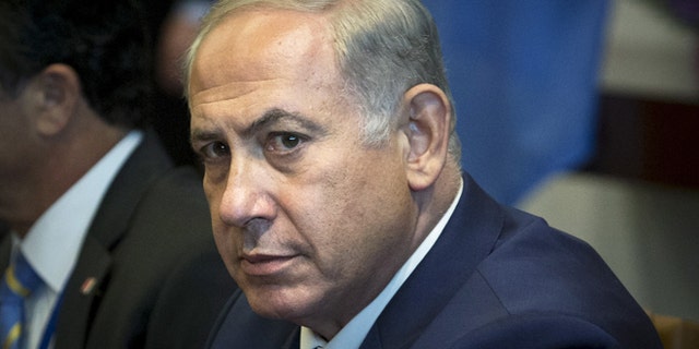 Israeli Prime Minister Benjamin Netanyahu sits to meet with U.N. Secretary-General Ban Ki-moon during the United Nations General Assembly at the United Nations in Manhattan, New York, October 1, 2015. REUTERS/Andrew Kelly - RTS2NYR