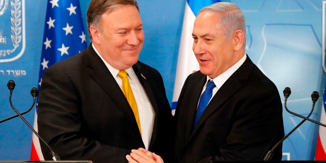 In this Sunday, April 29, 2018 file photo, U.S. Secretary of State Mike Pompeo (left) is greeted by Israeli Prime Minister Benjamin Netanyahu ahead of a press conference at the Ministry of Defense in Tel Aviv.