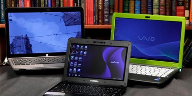 The HP Pavilion dm4, left, the Sony Vaio, right, laptops and the Samsung NB30 netbook are shown in this photo, in New York, Wednesday, Aug. 11, 2010.