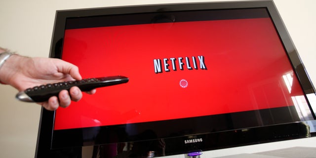 July 20, 2010. A person uses Netflix in Palo Alto, Calif. Netflix is tapping into six new markets on Monday hoping to gain hundred thousand new subscribers and balance out the billions spent on entertainment content each year. Their presence is welcome in most European countries, but in France Netflix is facing government-imposed regulatory hurdles and pressure from established local competitors.