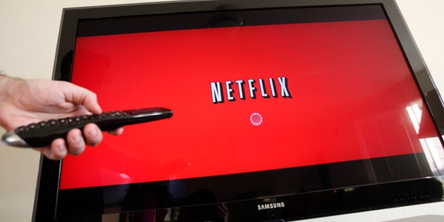 In this July 20, 2010 file photo, a person uses Netflix in Palo Alto, Calif.