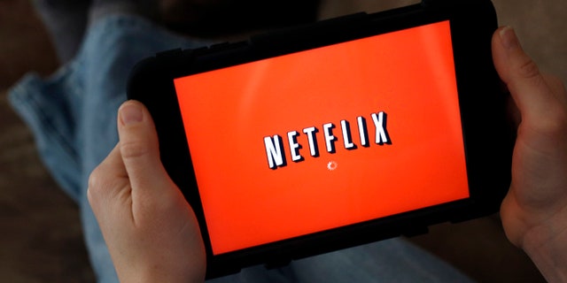 Jan. 17, 2014: A person displays Netflix on a tablet in North Andover, Mass.