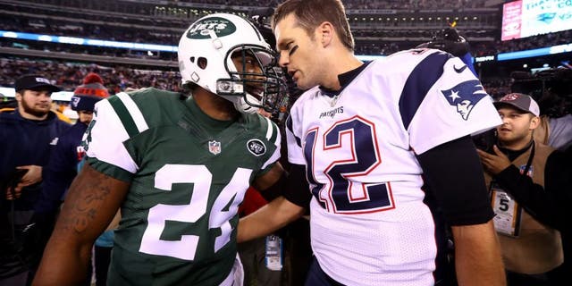 EAST RUTHERFORD, NJ - NOVEMBER 27: (L-R) Darrelle Revis #24 of the New York Jets talks with Tom Brady #12 of the New England Patriots after their game at MetLife Stadium on November 27, 2016 in East Rutherford, New Jersey. The New England Patriots defeated the New York Jets with a score of 22 to 17. (Photo by Al Bello/Getty Images)