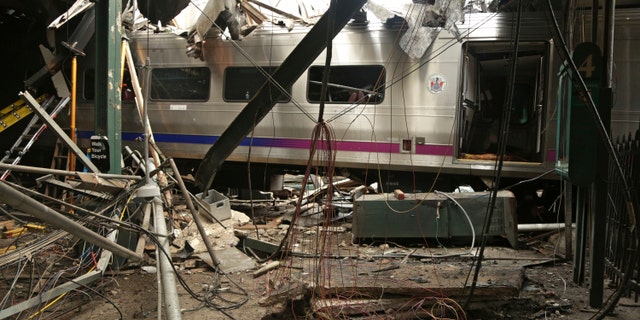 This Oct. 1, 2016, file photo provided by the National Transportation Safety Board shows damage from a Sept. 29, 2016, commuter train crash that killed a woman and injured more than 100 people at the Hoboken Terminal in Hoboken, N.J. Thomas Gallagher, the engineer of the commuter train that slammed into the station going double the 10 mph speed limit, suffered from sleep apnea that had gone undiagnosed, his lawyer told The Associated Press on Wednesday, Nov. 16, 2016. A U.S. official told the AP that investigators are looking at it as a potential cause.