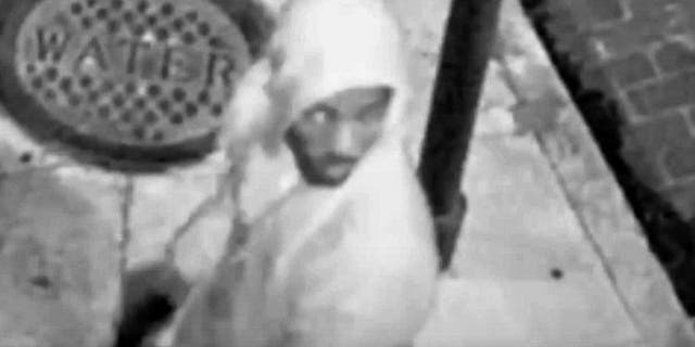 Image from surveillance video shows hooded man in shooting of a Good Samaritan trying to help a mugging victim. (NOPD)