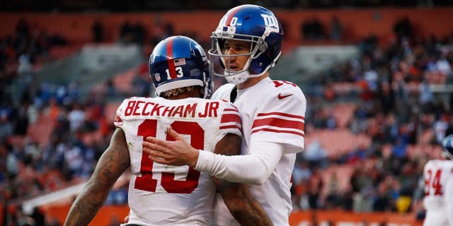 Odell Beckham #13 of the New York Giants celebrates his touchdown with Eli Manning #10 during the fourth quarter against the Cleveland Browns at FirstEnergy Stadium on November 27, 2016 in Cleveland, Ohio.