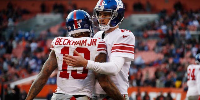 Odell Beckham #13 of the New York Giants celebrates his touchdown with Eli Manning #10 during the fourth quarter against the Cleveland Browns at FirstEnergy Stadium on November 27, 2016 in Cleveland, Ohio.