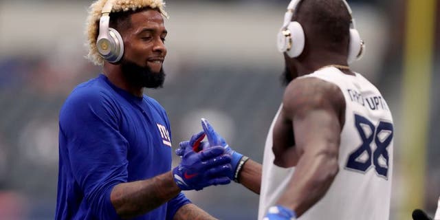 ARLINGTON, TX - SEPTEMBER 11: Odell Beckham #13 of the New York Giants greets Dez Bryant #88 of the Dallas Cowboys during pregame warm up at AT&T Stadium on September 11, 2016 in Arlington, Texas. (Photo by Tom Pennington/Getty Images)