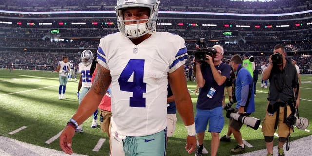 ARLINGTON, TX - SEPTEMBER 11: Dak Prescott #4 of the Dallas Cowboys walks off the field after losing to the New York Giants 20-19 at AT&T Stadium on September 11, 2016 in Arlington, Texas. (Photo by Tom Pennington/Getty Images)