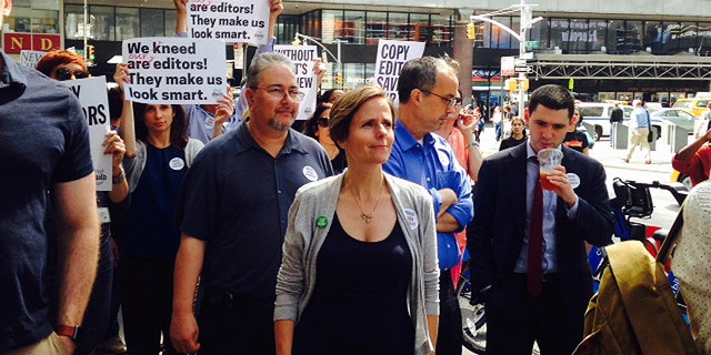 Journalists at the New York Times staged a brief demonstration outside their office Thursday to protest planned cuts to the newspaper’s copy editing staff.