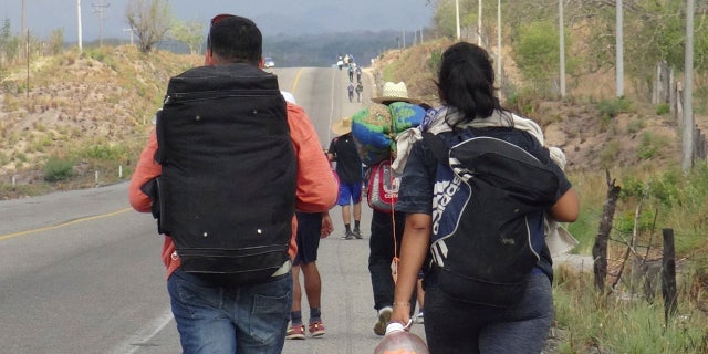 Central American migrants arrive in Ixtepec, Oaxaca, Mexico, before continuing their journey to the U.S.