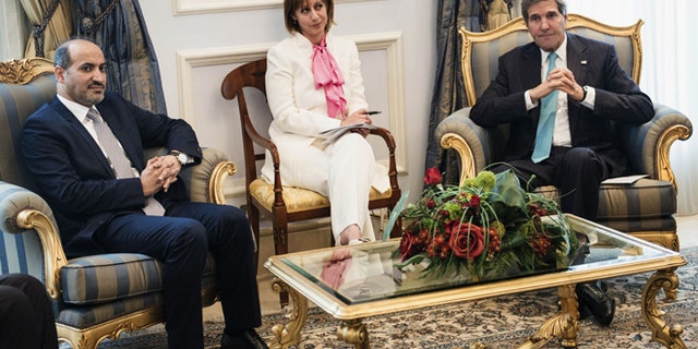 June 27, 2014: Syrian opposition leader President Ahmad al-Jarba, left, and U.S. Secretary of State John Kerry wait prior to a meeting at King Abdulaziz International Airport in Jeddah, Saudi Arabia. (AP)