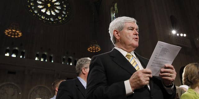 Former Speaker Newt Gingrich sings during Easter Mass at the Basilica of the National Shrine of the Immaculate Conception Roman Catholic Church Sunday, April 24, 2011 in Washington. (AP Photo/Alex Brandon)