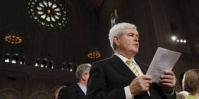 Former Speaker Newt Gingrich sings during Easter Mass at the Basilica of the National Shrine of the Immaculate Conception Roman Catholic Church Sunday, April 24, 2011 in Washington. (AP Photo/Alex Brandon)