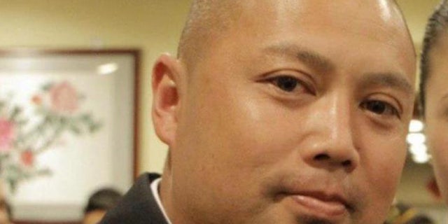 Officer Alex Chapackdee was charged Monday with conspiracy to distribute marijuana.