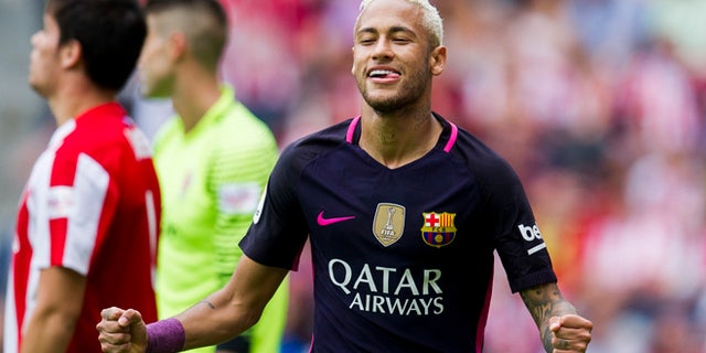GIJON, SPAIN - SEPTEMBER 24: Neymar of FC Barcelona celebrates after scoring his team's third goal during the La Liga match between Real Sporting de Gijon and FC Barcelona at Estadio El Molinon on September 24, 2016 in Gijon, Spain. (Photo by Juan Manuel Serrano Arce/Getty Images)