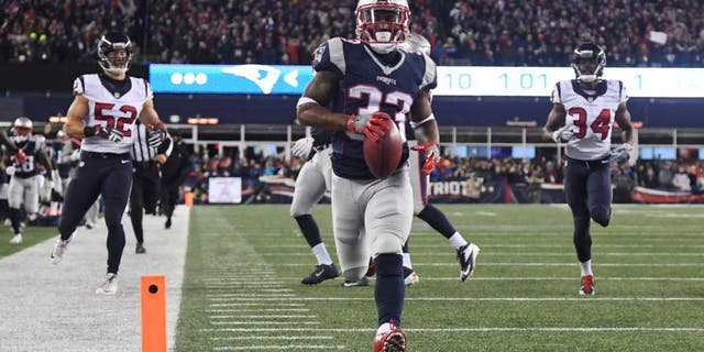Jan 14, 2017; Foxborough, MA, USA; New England Patriots running back Dion Lewis (33)returns a kick for a touchdown against the Houston Texans during the first quarter in the AFC Divisional playoff game at Gillette Stadium. Mandatory Credit: James Lang-USA TODAY Sports