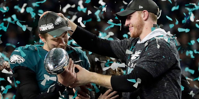 Eagles quarterbacks Nick Foles and Carson Wentz celebrate.