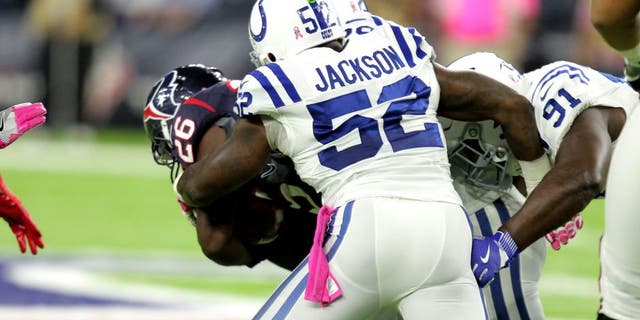 Oct 16, 2016; Houston, TX, USA; Indianapolis Colts inside linebacker D'Qwell Jackson (52) tackles Houston Texans running back Lamar Miller (26) during the second quarter at NRG Stadium. Mandatory Credit: Erik Williams-USA TODAY Sports