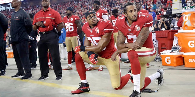 Colin Kaepernick and Eric Reid kneeling during the national anthem during the 2016 season.