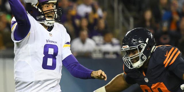 Oct 31, 2016; Chicago, IL, USA; Chicago Bears defensive end Cornelius Washington (90) pressures Minnesota Vikings quarterback Sam Bradford (8) during the second half at Soldier Field. Mandatory Credit: Mike DiNovo-USA TODAY Sports