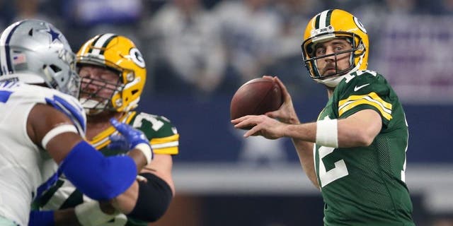 Jan 15, 2017; Arlington, TX, USA; Green Bay Packers quarterback Aaron Rodgers (12) throws a pass against the Dallas Cowboys during the first quarter in the NFC Divisional playoff game at AT&amp;T Stadium. Mandatory Credit: Matthew Emmons-USA TODAY Sports