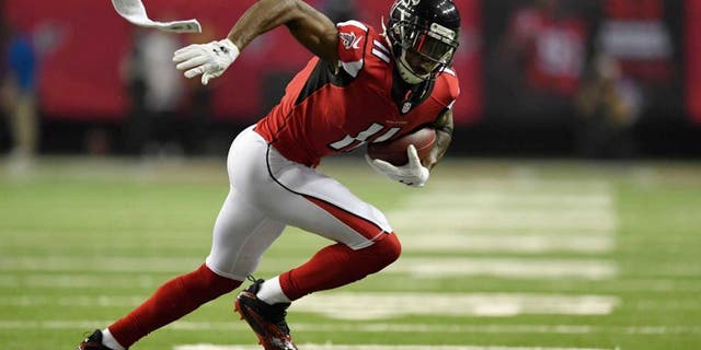 Jan 14, 2017; Atlanta, GA, USA; Atlanta Falcons wide receiver Julio Jones (11) runs after a catch against the Seattle Seahawks during the second quarter in the NFC Divisional playoff at Georgia Dome. Mandatory Credit: Dale Zanine-USA TODAY Sports