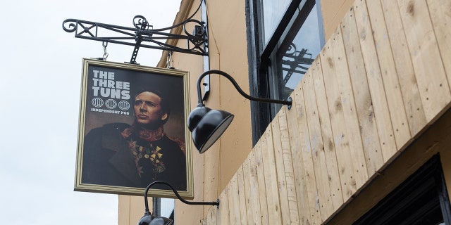 A Nicolas Cage-obsessed pub in England gave the actor a permanent home on their sign.