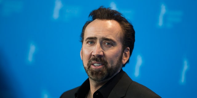 Nicolas Cage, the voice of the character Grug, poses during a photocall promoting the animation movie "The Croods" at the 63rd Berlinale International Film Festival in Berlin February 15, 2013. REUTERS/Thomas Peter  (GERMANY  - Tags: ENTERTAINMENT) - RTR3DU1U