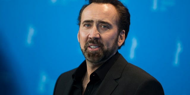 Nicolas Cage, the voice of the character Grug, poses during a photocall promoting the animation movie "The Croods" at the 63rd Berlinale International Film Festival in Berlin February 15, 2013. REUTERS/Thomas Peter (GERMANY - Tags: ENTERTAINMENT) - RTR3DU1U