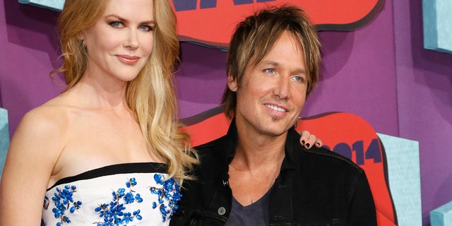 Actress Nicole Kidman and her husband, musician Keith Urban, arrive at the 2014 CMT Music Awards in Nashville, Tennessee June 4, 2014.