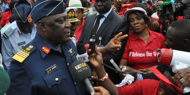 May 26, 2014: Nigeria's chief of defense staff Air Marshal Alex S. Badeh, center, speaks during a demonstration calling on the government to rescue the kidnapped girls of the government secondary school in Chibok, in Abuja, Nigeria, Monday.