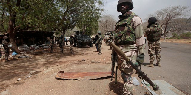 Nigerian soldiers man a checkpoint in Gwoza, Nigeria.