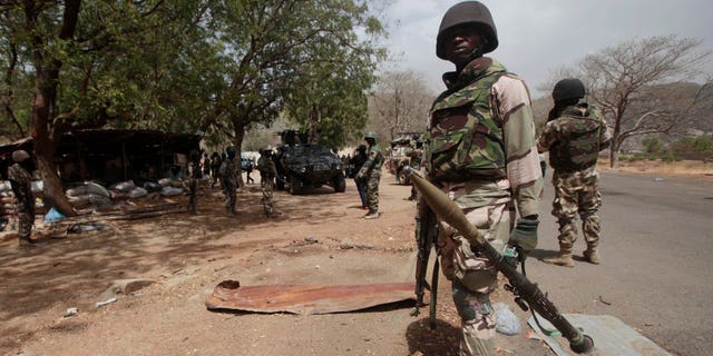 Nigerian soldiers man a checkpoint in Gwoza, Nigeria.