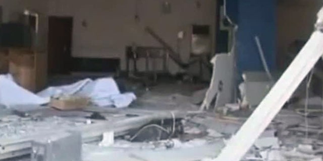 Nov. 6, 2011: In this image made from television released by the state-run Nigerian Television Authority, a damaged building is seen in Damatura, Nigeria, following a series of coordinated attacks Friday that killed at least 100 people and left a new police headquarters in ruins, government offices burned and symbols of state power destroyed.