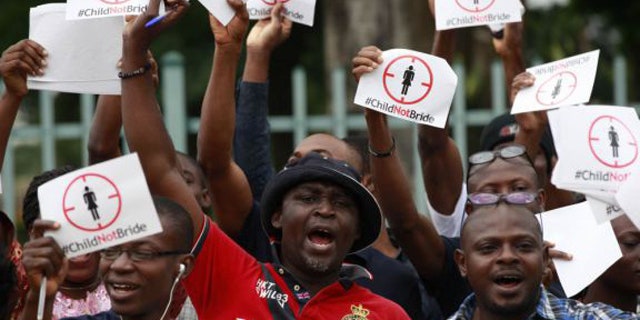 July 20, 2013: People protest against underage marriages in Lagos, Nigeria. (AP/Sunday Alamba, File)