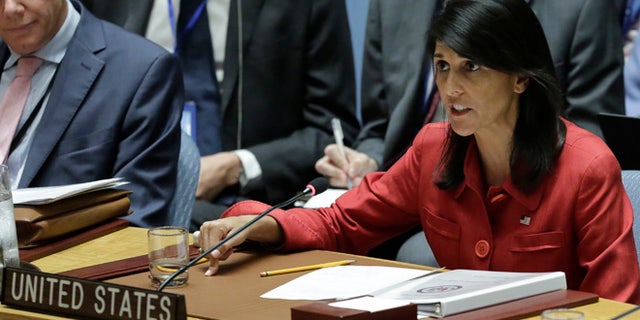 United Kingdom U.N. Ambassador Matthew Rycroft, left, listens as United States U.N. Ambassador Nikki Haley, right, respond to Russia's statements, during United Nations Security Council meeting on North Korea's latest launch of an intercontinental ballistic missile, Wednesday July 5, 2017 at U.N. headquarters. (AP Photo/Bebeto Matthews)