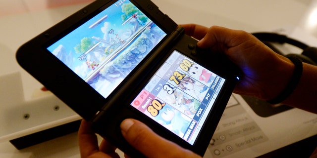 File photo: An attendee plays the Super Smash Bros game for Nintendo 3DS at the 2014 Electronic Entertainment Expo, known as E3, in Los Angeles, California June 11, 2014. (REUTERS/Kevork Djansezian)