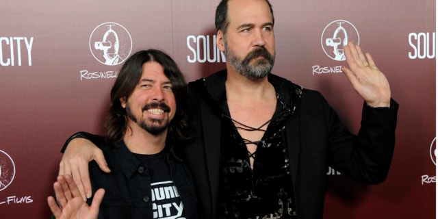 Jan. 31, 2013: Dave Grohl, left, poses with Nirvana bandmate Krist Novoselic at the premiere of the documentary film "Sound City," in Los Angeles.