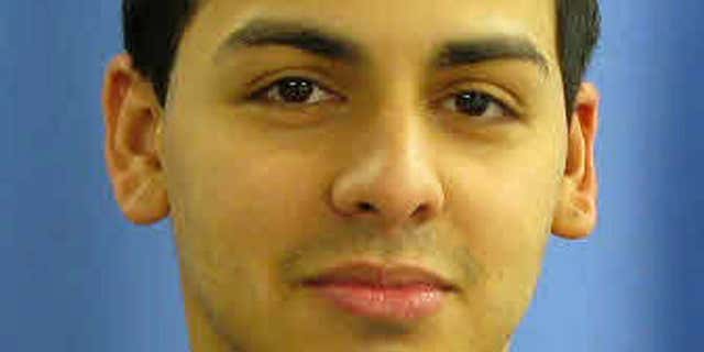 In this undated photo provided by the Linden, N.J. Police Department, Police Officer Pedro Abad is shown. Abad, 27, is in critical condition after the car he was driving struck a truck head-on, while travelling in the wrong direction on a Staten Island N.Y., highway