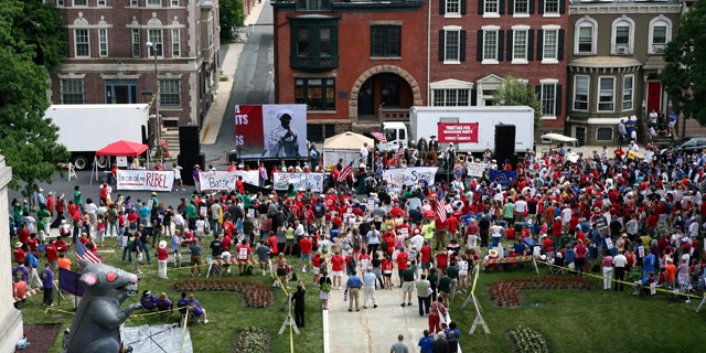 June 20: A large gathering of public employee union members and supporters protest in Trenton, N.J., outside the Statehouse over plans by Gov. Chris Christie to reduce benefits and limit collective bargaining over health care for public workers.