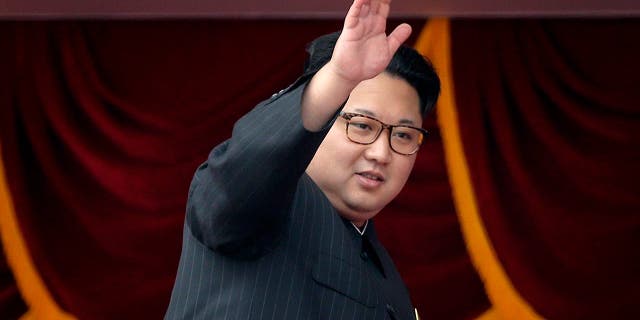 Kim Jong Un waves at parade participants at Kim Il Sung Square in Pyongyang, North Korea, on May 10, 2016.