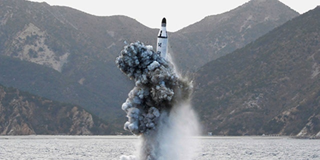 North Korean leader Kim Jong Un guides on the spot the underwater test-fire of strategic submarine ballistic missile in this undated photo released by North Korea's Korean Central News Agency (KCNA) in Pyongyang on April 24, 2016. KCNA/via REUTERS. ATTENTION EDITORS - THIS IMAGE WAS PROVIDED BY A THIRD PARTY. EDITORIAL USE ONLY. REUTERS IS UNABLE TO INDEPENDENTLY VERIFY THIS IMAGE. SOUTH KOREA OUT. TPX IMAGES OF THE DAY - RTX2BDTM