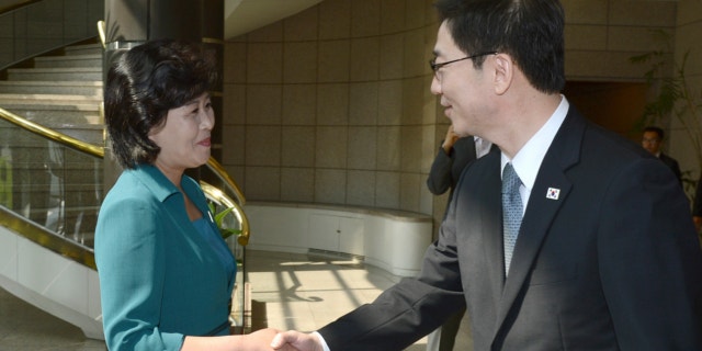 June 9, 2013: In this photo released by the South Korean Unification Ministry, South Korea's Unification Policy Officer Chun Hae-sung, right, shakes hands with the head of North Korea's delegation Kim Song Hye, left, upon Kim's arrival to their meeting at the southern side of Panmunjom, which has separated the two Koreas since the Korean War, in Paju, north of Seoul, South Korea.