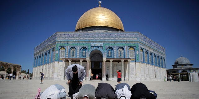 Oct. 5, 2014: Palestinians from Gaza pray in front of the Dome of the Rock during their visit at the compound known to Muslims as Noble Sanctuary and to Jews as Temple Mount in Jerusalem's Old City.