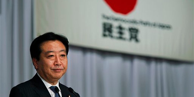 New leader of the Democratic Party of Japan Yoshihiko Noda speaks during a press conference shortly after his election at a voting by the party lawmakers in Tokyo Monday, Aug. 29, 2011.